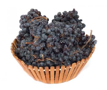 black grapes in a basket on a white background