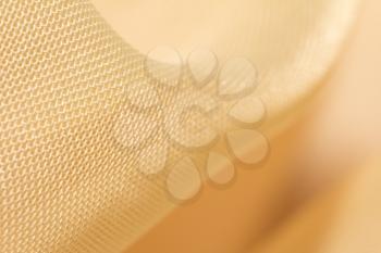 golden fabric as a background. macro
