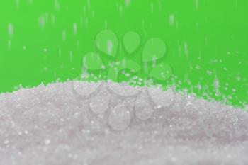 sugar on a green background. macro