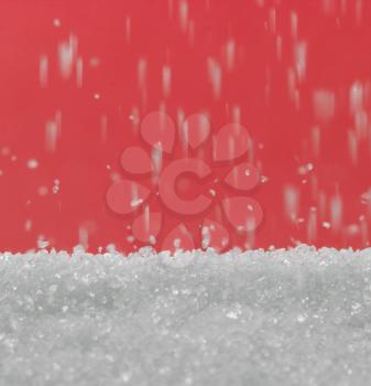 sugar on a red background. macro