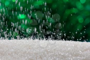 sugar on a green background. macro