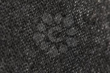 background of black knitted fabric