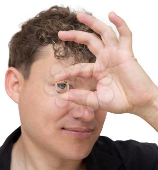 man holding a gold ring on a white background