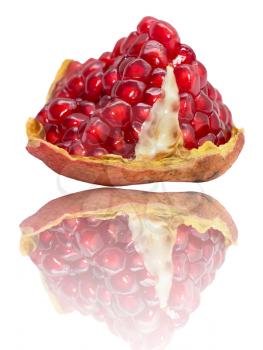pomegranate with reflection on white background