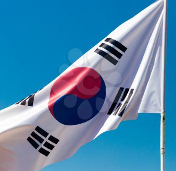Flag of South Korea against the blue sky .
