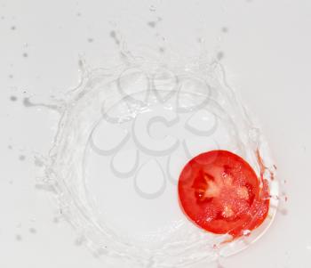 tomato in water on white background