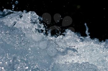 rough water with splashes on a black background
