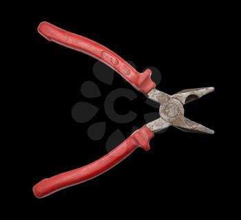 red pliers on black background
