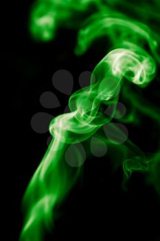 green smoke on black background