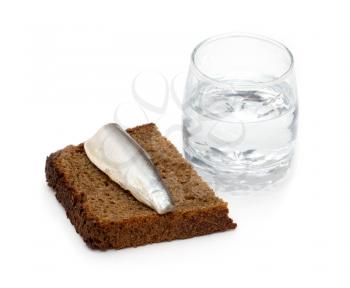 a shot of vodka with a fish on bread