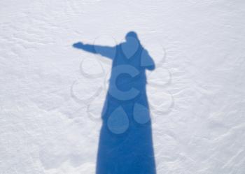 shadow of a man in the snow