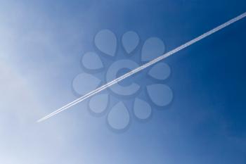 trace of the aircraft in the blue sky