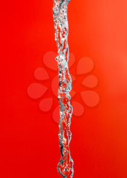 water jet on a red background