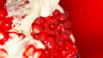 Ripe red pomegranate in water