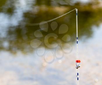 rod on a river in nature