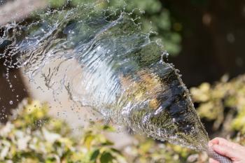 splashes of water from the hose