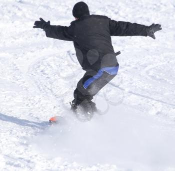 people snowboarding on the snow in the winter