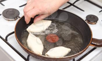 Food patties in a frying pan
