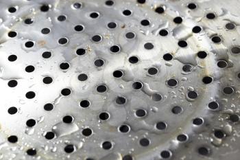 chromed metal in water drops