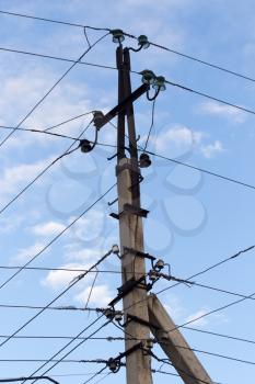 Mast electrical power line against cloud and blue sky