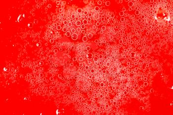 drops of honey on a red background