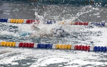 boy goes in for sports in the pool