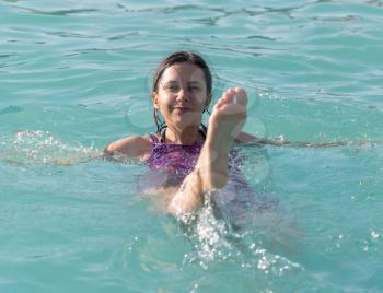 girl in a bathing suit in the water park