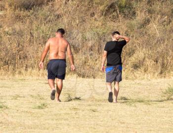 two men in shorts outdoors