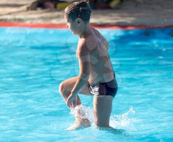 Boy swims in the water park