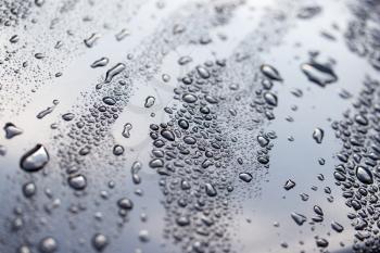 drops of water on a dark car
