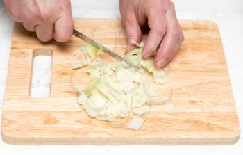 Cook chopped onion on the board