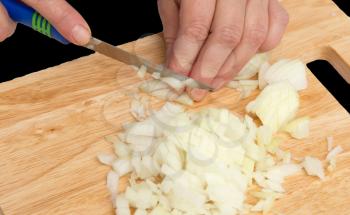 cook onion cut on a board on a black background