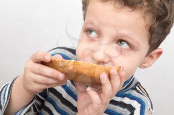 boy eats bread