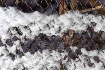 snow on the fence as a backdrop