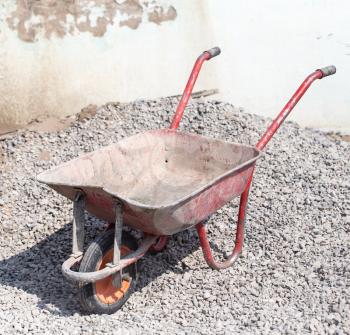 A cement wheelbarrow at the construction site