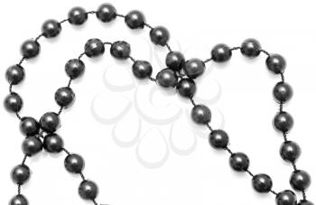 Black beads on a rope on a white background