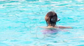 Girl bathes in the pool . A photo
