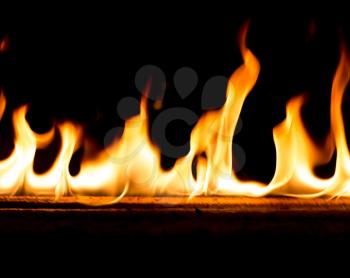 Strip of fire on a black background .