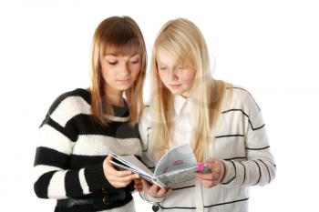 Royalty Free Photo of Two Girls Reading a Book