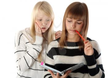 Royalty Free Photo of Two Girls Reading a Diary