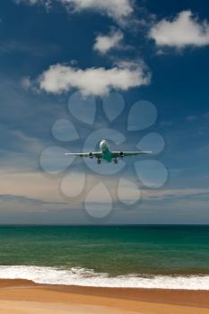 Royalty Free Photo of an Airplane Over Water