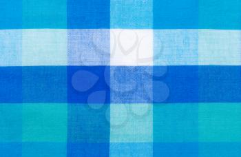 Fabric background of the large cells of blue, green and white