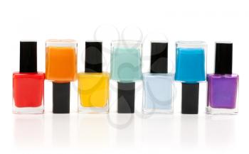 Bottles of nail lacquer set in the sequence of the rainbow