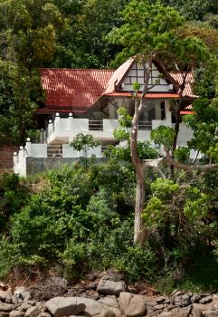 a lone house in the tropical jungles of Thailand