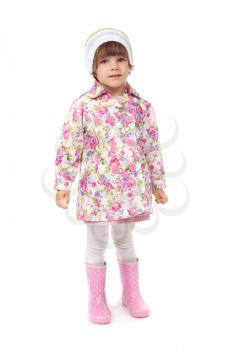 little girl in boots and a jacket in the studio. Isolate on white