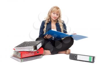 Beautiful girl sitting on the floor with folders for documents. Isolate on white background.