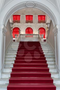 staircase, the entrance to the palace with the red carpet