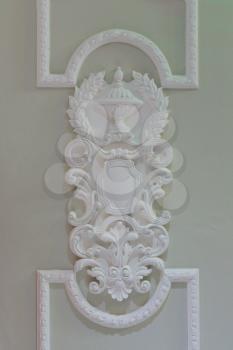decorative moldings on the white wall