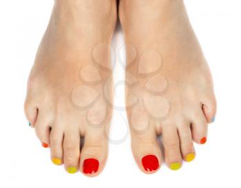 Female feet with a pedicure color on a white background