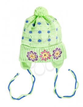green baby knitted hat with a flower pattern on a white background